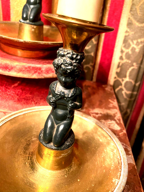 Pair of charming Empire/Restoration style table candlesticks in gilded bronze and dark green patina