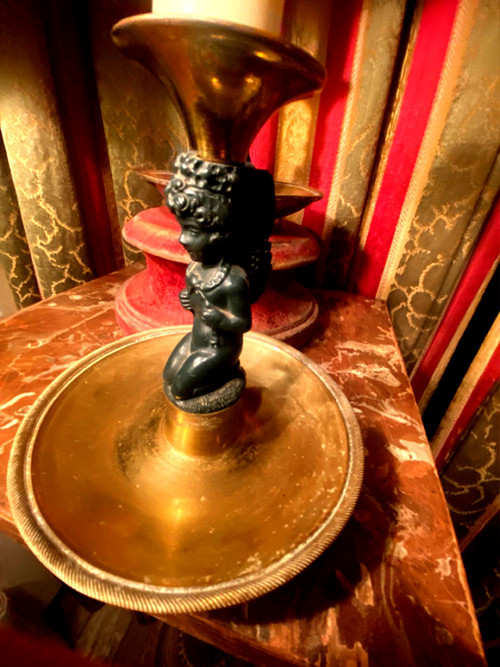 Pair of charming Empire/Restoration style table candlesticks in gilded bronze and dark green patina