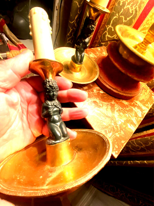 Pair of charming Empire/Restoration style table candlesticks in gilded bronze and dark green patina