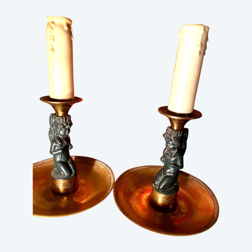 Pair of charming Empire/Restoration style table candlesticks in gilded bronze and dark green patina