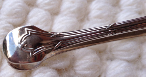 Silver metal sugar tongs model Ribbons goldsmith Christofle