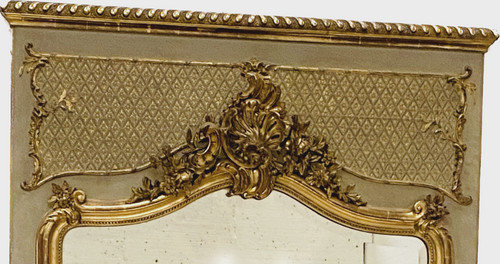Specchiera in stile Luigi XV in legno e stucco dorato XX secolo