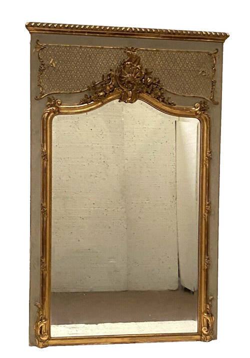 Specchiera in stile Luigi XV in legno e stucco dorato XX secolo
