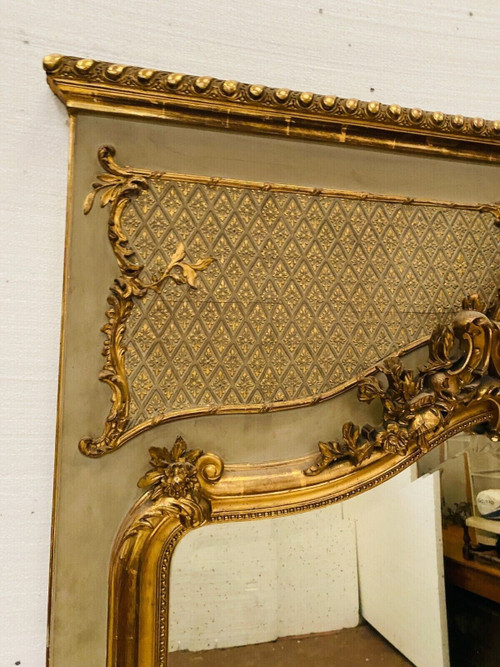 Specchiera in stile Luigi XV in legno e stucco dorato XX secolo