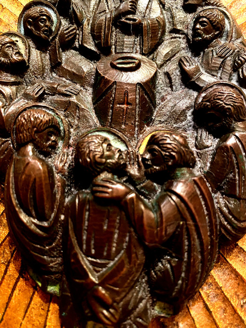 Decorative element featuring the image of Christ and his Apostles in patinated bronze with touches of colored enamel.
