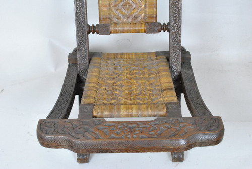 Sedia pieghevole in legno esotico intagliato e canna, Asia, Fine XIX/Inizio XX secolo