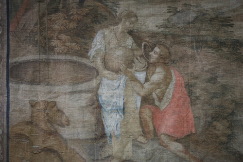 Grande toile peinte du XVIIIe, "la halte d'une caravane à un puits"