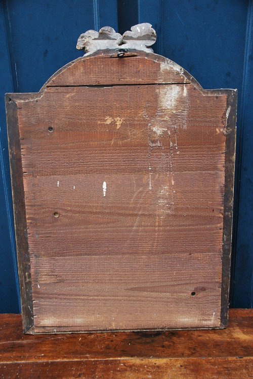 Specchio in legno dorato con teste d'angelo, XVIII secolo