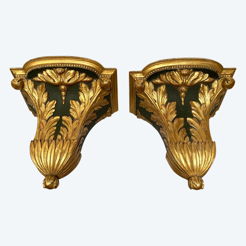 Pair of 19th century wall consoles. Carved, painted and gilded wood.