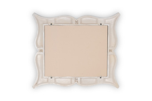 Art Deco style stucco mirror in “mustache” shape. 1990s.