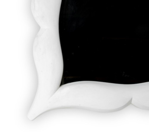 Art Deco style stucco mirror in “mustache” shape. 1990s.