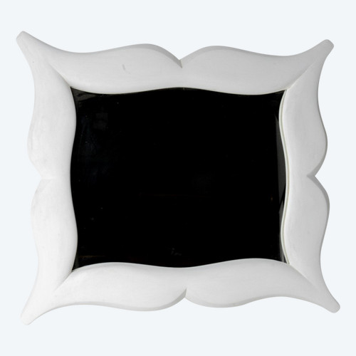 Art Deco style stucco mirror in “mustache” shape. 1990s.