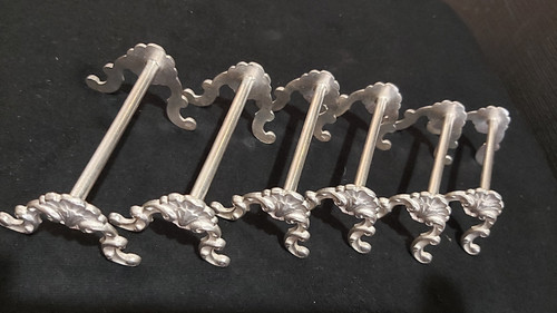 12 porte-couteaux coquille métal argenté 