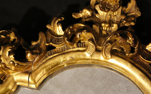  18th century Italian baroque mirror, gilded wood leaf