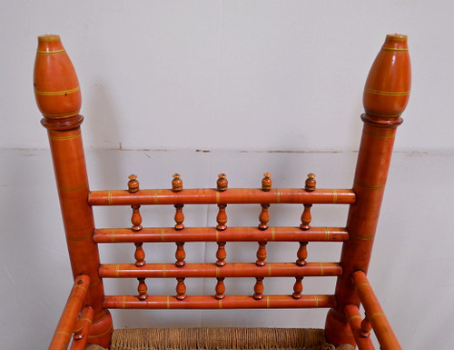 Poltrona in legno dipinto e corda intrecciata, India - Prima metà del XX secolo