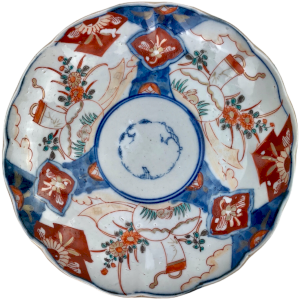 Imari Japon porcelain plate decorated with landscape, flowers, hare and cornucopia.