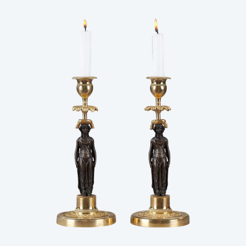 Pair of candlesticks in patinated and gilded bronze