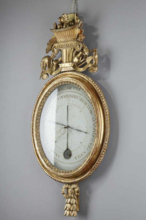 Barometer-thermometer in gilt wood, Louis XVI period