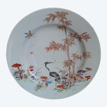 18th c Chinese plate decorated with a black crane amongst golden bamboo and lingzhi.