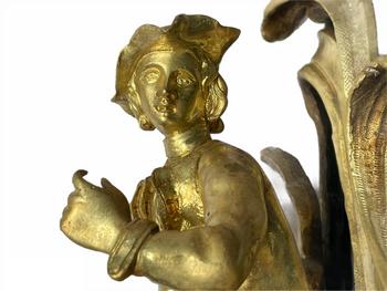 Pair of Louis XV style gilt bronze andirons representing a couple seated on rockery