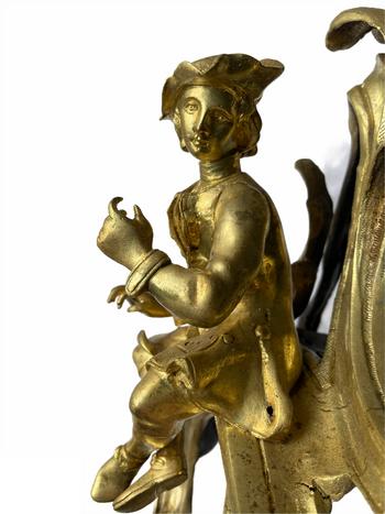 Pair of Louis XV style gilt bronze andirons representing a couple seated on rockery