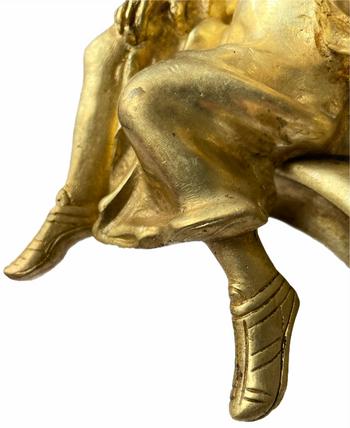Pair of Louis XV style gilt bronze andirons representing a couple seated on rockery