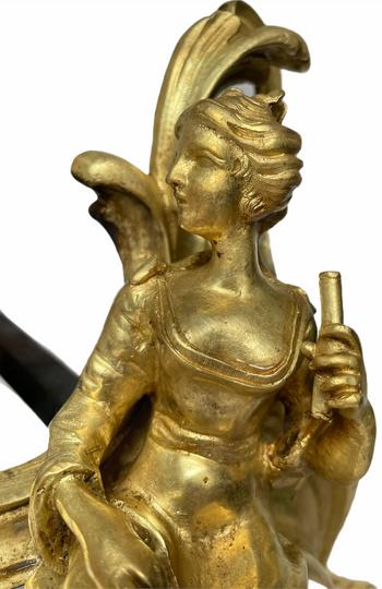Pair of Louis XV style gilt bronze andirons representing a couple seated on rockery