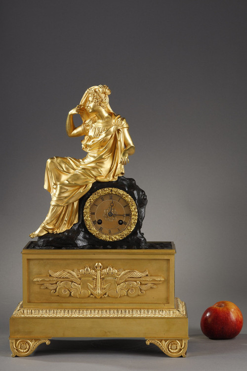 Restoration period Clock in gilt bronze with a young woman