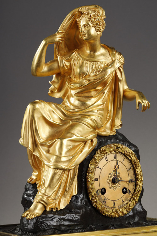 Restoration period Clock in gilt bronze with a young woman