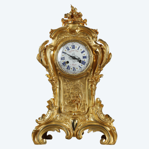 ORMOLU AND CHASED BRONZE ROCAILLE CLOCK, RAINGO AND BROTHERS 