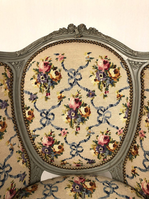 Paire de bergères à oreilles de style Louis XVI en bois laqué gris. Fin XIXe
