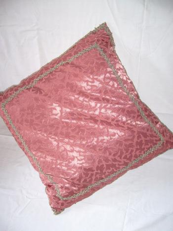 Damask and braid cushion