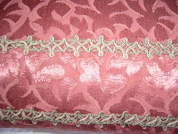 Damask and braid cushion