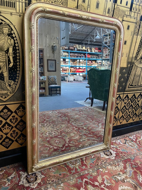 Louis Philippe period mirror in gold leaf