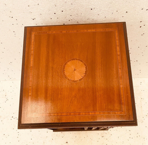 Mahogany revolving bookcase with inlaid top 20th century