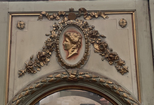 19th century patinated and gilded wood and stucco fireplace mirror