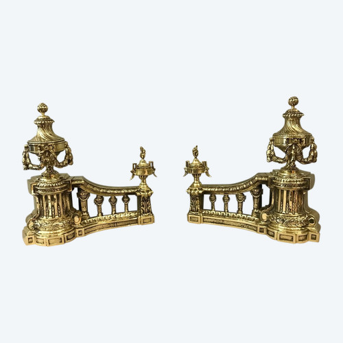 Fine antique polished bronze andirons from the 19th century in the Louis XVI style