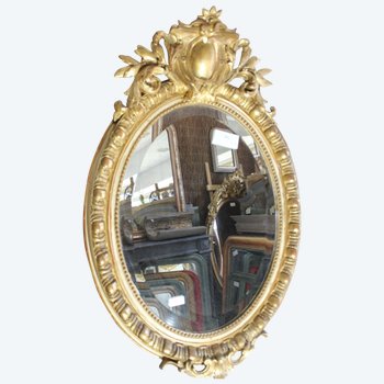 Antique Napoleon III oval mirror in gilded Louis XV style