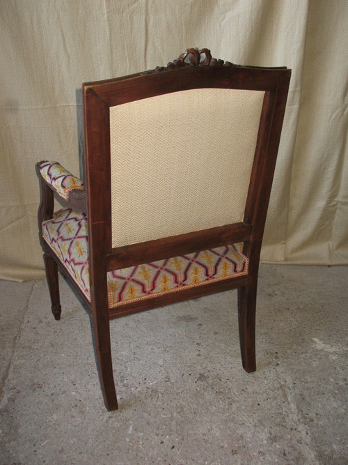 Pair of walnut armchairs with flat backs, 19th century Louis XVI style, stitched trim