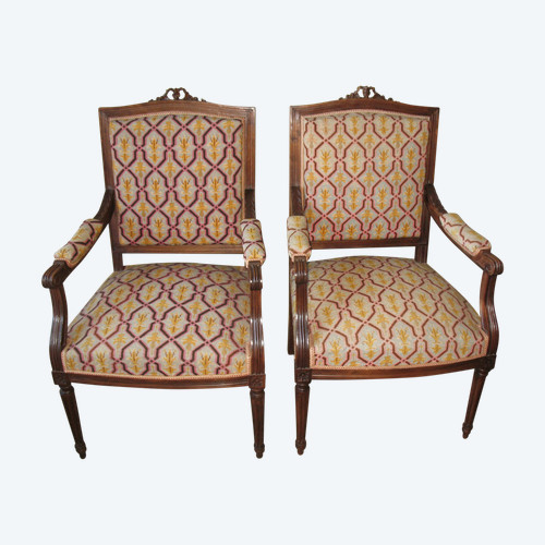 Pair of walnut armchairs with flat backs, 19th century Louis XVI style, stitched trim