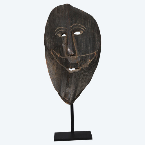 Smiling figure carved from a palm stem – Himalayas