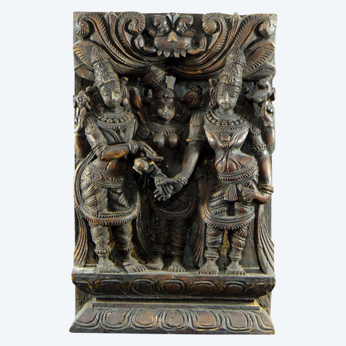 India, 20th century, carved wooden chariot panel representing the marriage of Meenakshi.