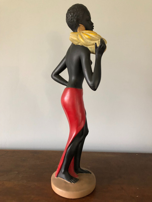 Orientalist polychrome plaster statue by Salvatore Melani (1902-1934) The Banana Carrier