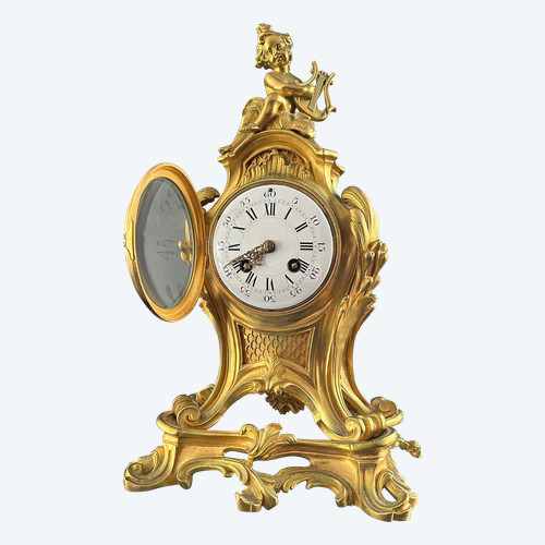 Orologio in bronzo dorato stile Luigi XV XIX secolo