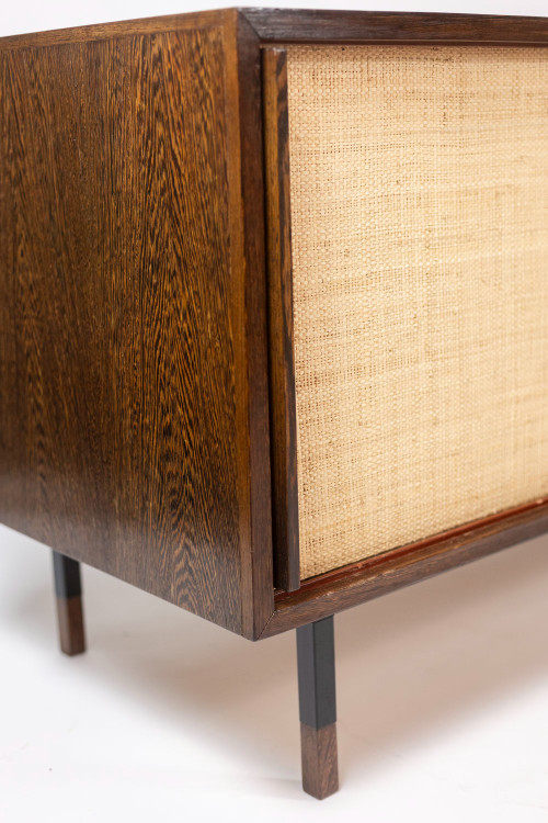 Sideboard in wenge, raffia and lacquered metal. 1970s.