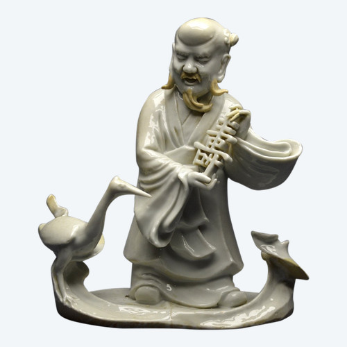 China, 18th century, Chinese white porcelain group depicting the Taoist god Shoulao