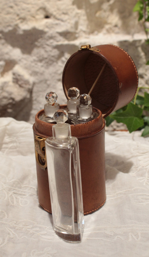 4 large bottles in leather case early 20th century