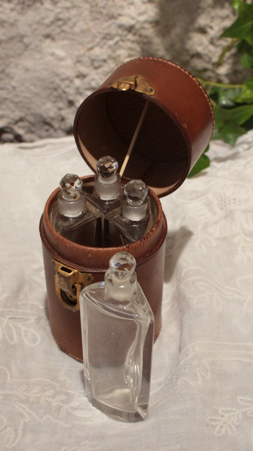 4 large bottles in leather case early 20th century