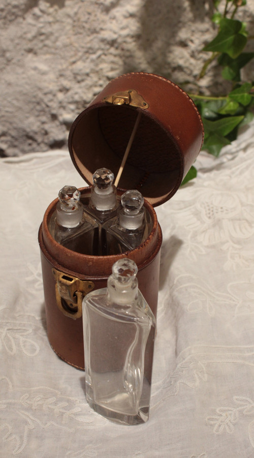4 large bottles in leather case early 20th century