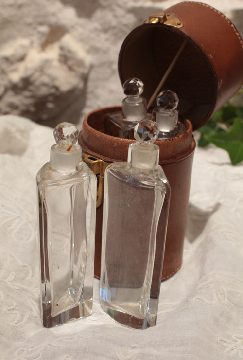 4 large bottles in leather case early 20th century